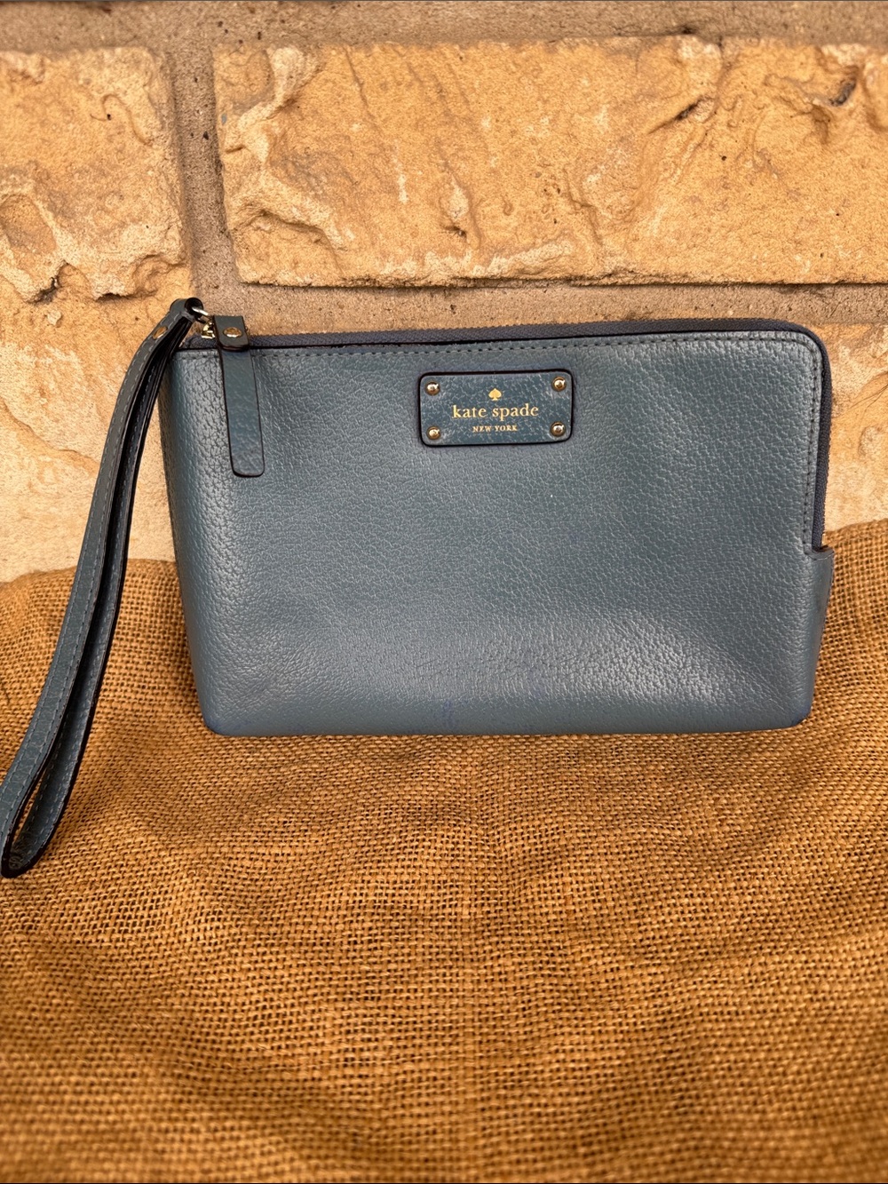 kate spade slate blue leather wristlet with gold plate Large